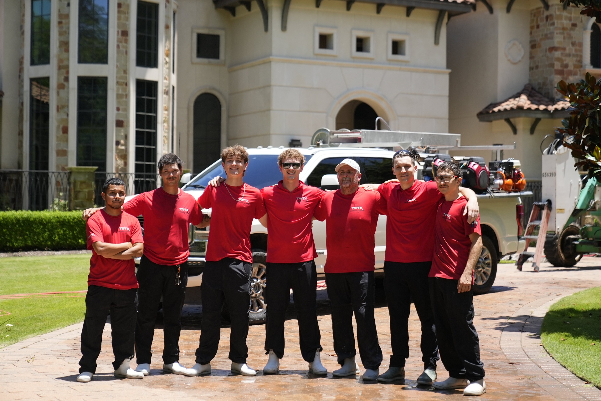 TWTX crew in front of a Houston-area estate